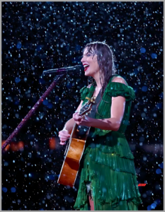  Taylor Swift performing in the rain during a concert.

