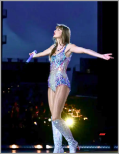  Taylor Swift performing in the rain during a concert.

